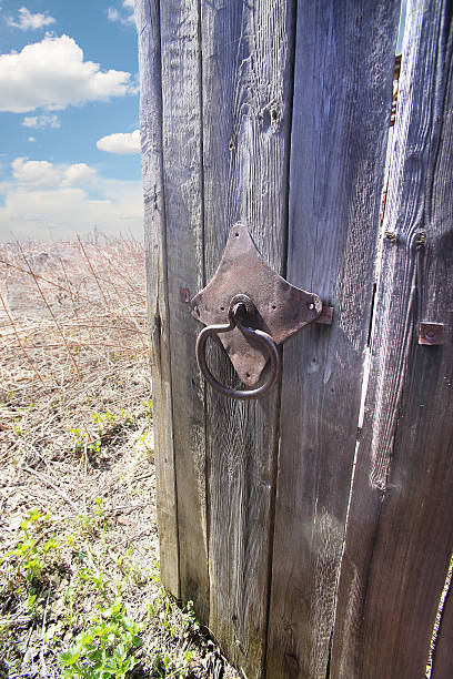 istock open door behind it field and sky 502998866