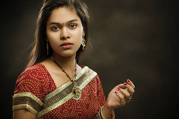 istock Married Hindu young woman looking at camera with blank expression. 502999514