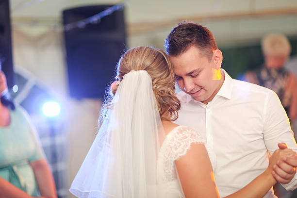 istock beautiful touching first dance of the bride and groom 503000954