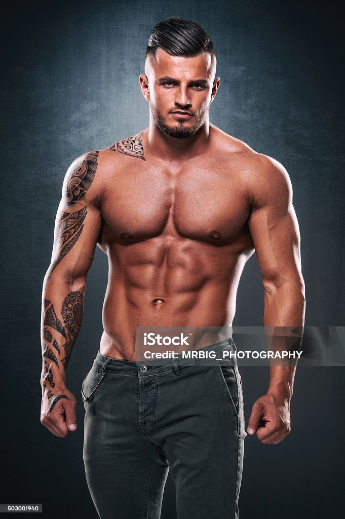 Handsome Men Portrait of sexy tattooed men Muscular Build Stock Photo