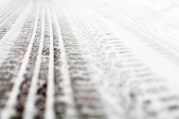 istock Wheel tracks on the road covered with snow 503002090