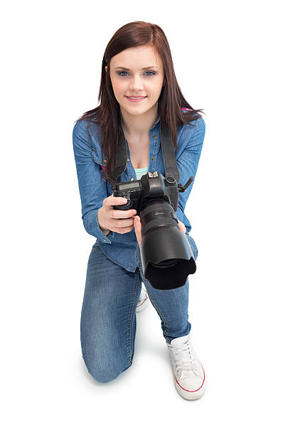 istock Cheerful young photographer posing 503006231