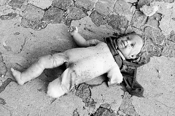 istock Broken doll lying on the floor. 503007303