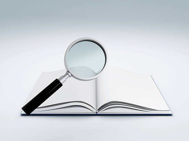 istock open book with magnifying glass 503007403