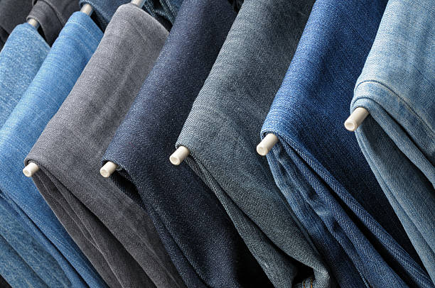 istock Colored jeans hanging on hangers 503011055