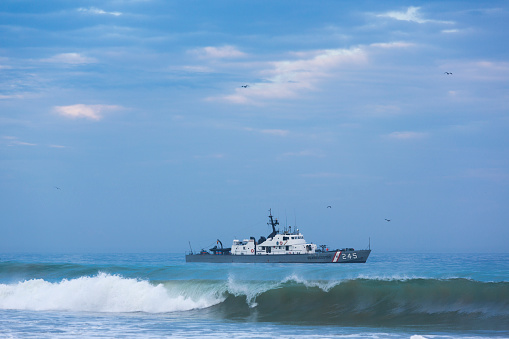 Mancora, Peru - February 1, 2015: Peruvian coast guard in action on the coast of Mancora looking for drug dealers in Peru 2015.