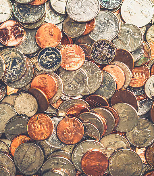 american waluty monet tle - bringing home the bacon image high angle view vertical zdjęcia i obrazy z banku zdjęć