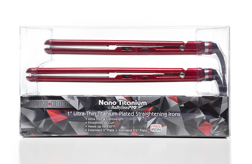 Miami, USA - December 5, 2015: Nano Titanium BaBylissPRO Crimson Collection ultra-thin titanium-plated straightening 2 irons package. Nano Titanium and BaBylissPRO brands are owned by Conair Corporation.