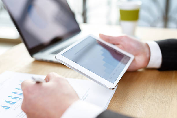 istock businessman checking financial reports on table 503019312