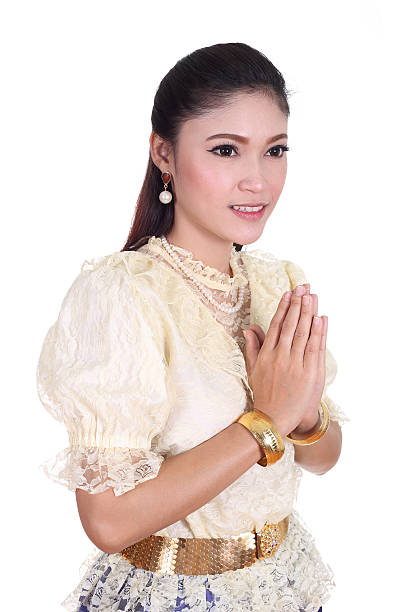 istock woman wearing typical thai dress pay respect 503024023