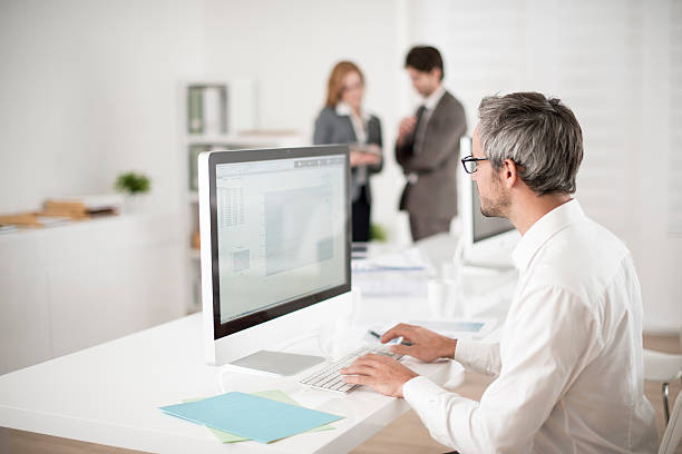 istock businessman works on his computer at workplace 503024659