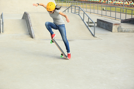 skateboarding woman at skatepark