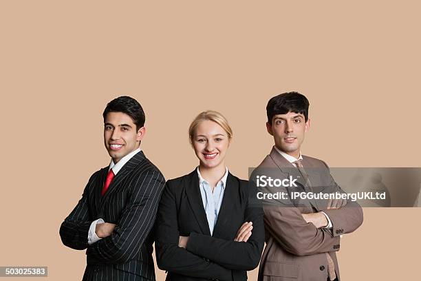 Portrait Of Happy Young Person Stock Photo - Download Image Now - Businessman, Yellow Background, Business Person