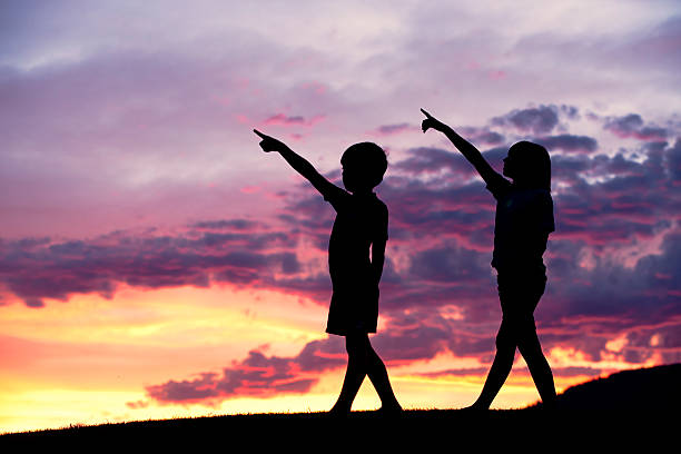 istock Poiting to the sky at sunset. 503026295
