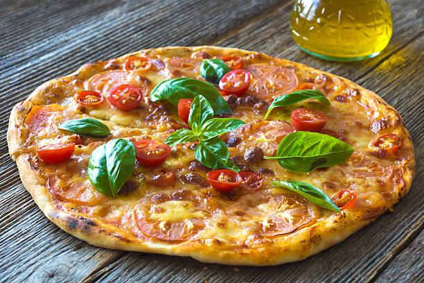 istock Pizza with mozzarella, tomato and basil leaves 503027448