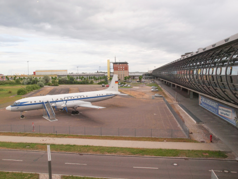 Leipzig, Germany - June 14, 2014: The Ilyushin IL-18 Coot is a large turboprop Soviet airliner aircraft from 1957 now in display in front of Flughafen Leipzig Hall airport