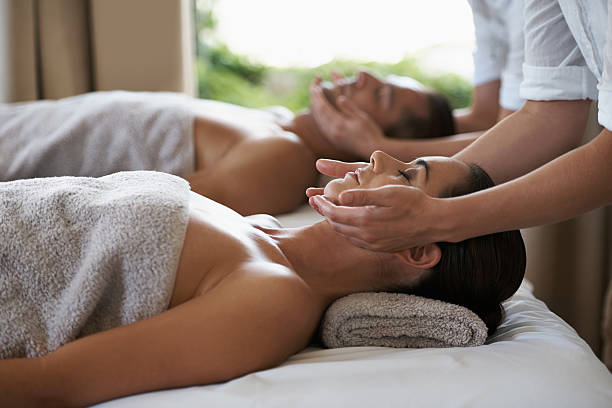 Miracle inducing hands Shot of a mature couple enjoying a relaxing massage spa stock pictures, royalty-free photos & images