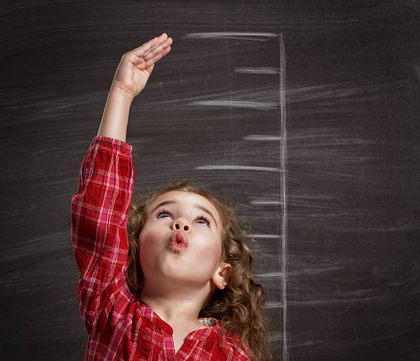 children dream beauty child at the blackboard human height stock pictures, royalty-free photos & images