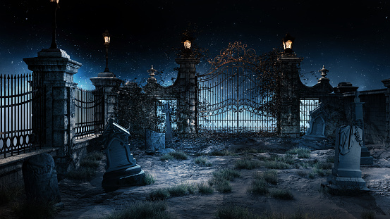 Old gothic cemetery with iron gate and lantern.