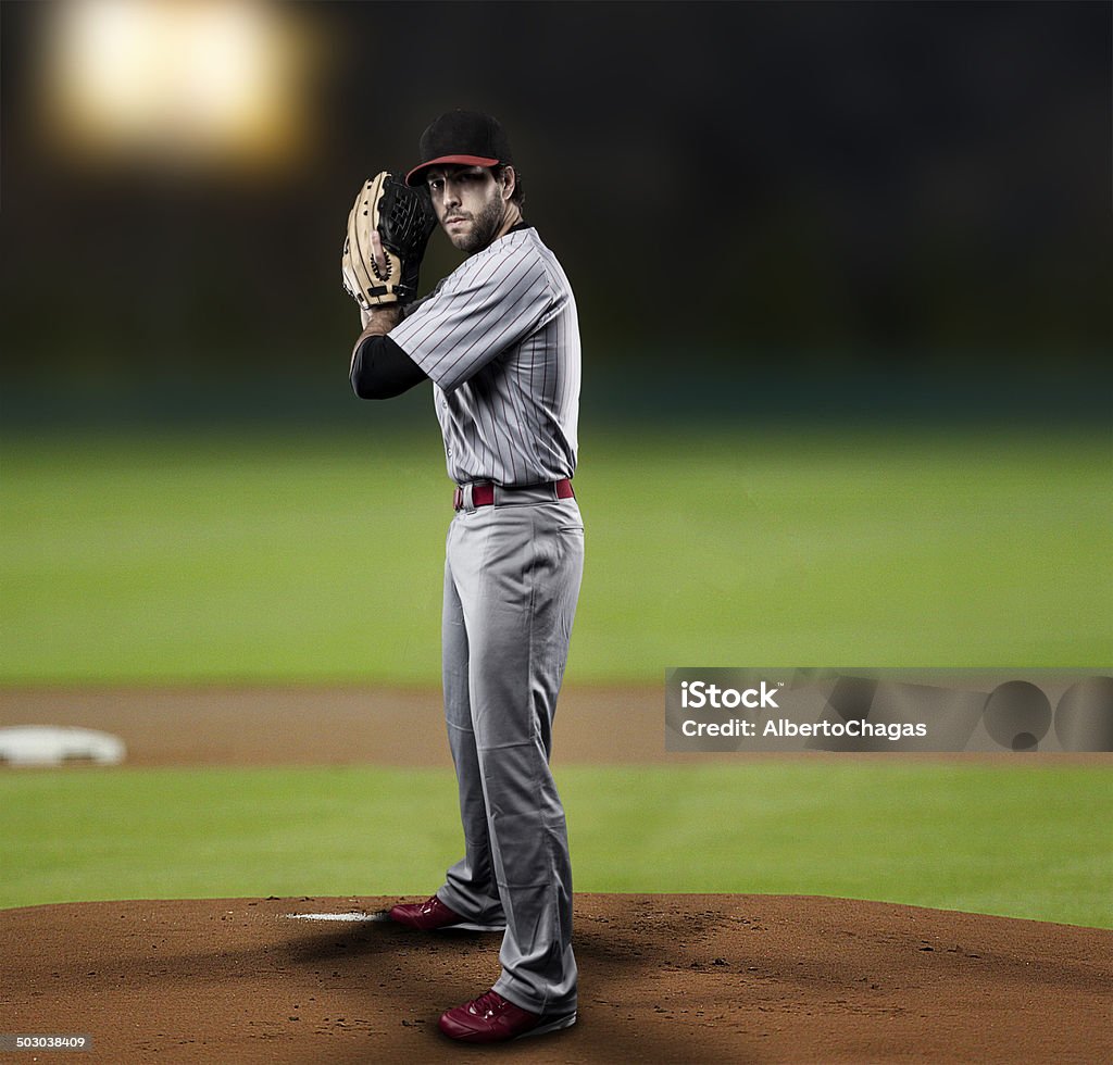 Pitcher Baseball Player Pitcher  Player throwing a ball, on a baseball Stadium. Athlete Stock Photo