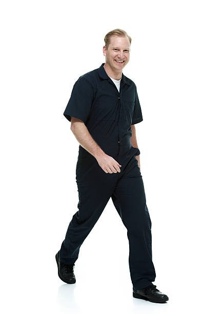 istock Smiling mechanic walking & looking at camera 503039053