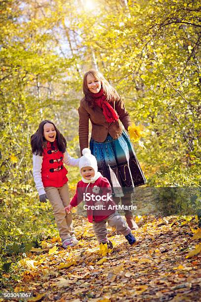 Family Of In Autumn Park Stock Photo - Download Image Now - Activity, Adult, Autumn