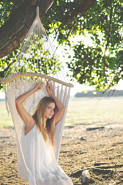 istock Beautiful woman in hammoc at summertime 503043017