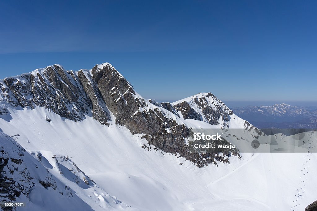 Winter mountain peak Winter snowy mountain peak and blue sky 2015 Stock Photo