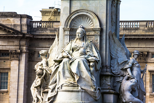 London, UK - June 4, 2015: Imperial Memorial to Queen Victoria (1911, designed by Sir Aston Webb) in front of Buckingham Palace was built in honor of Queen Victoria, who reigned for almost 64 years. 