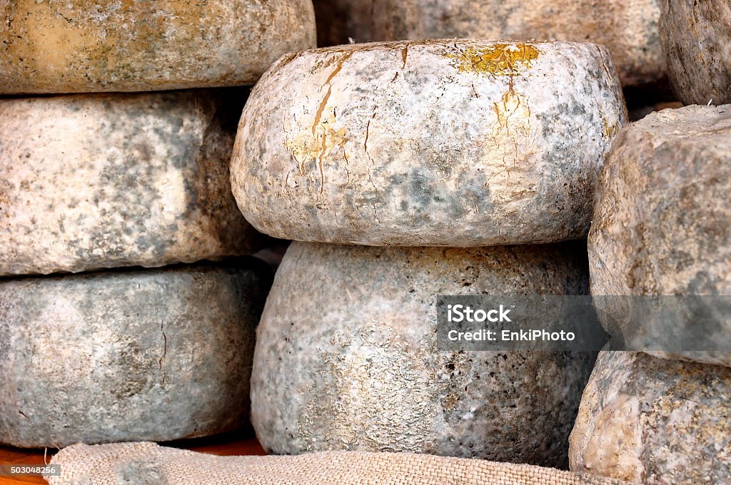 Pecorino cheese wheels Pecorino cheese wheels with mold on the skin for a better and longer conservation. Italy Stock Photo