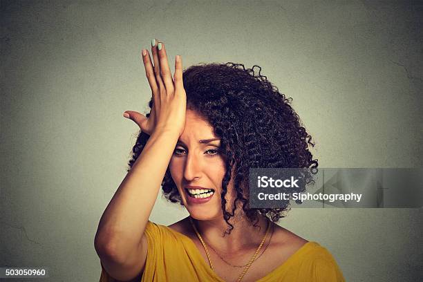 Woman Slapping Hand On Head To Say Duh Made Mistake Stock Photo - Download Image Now