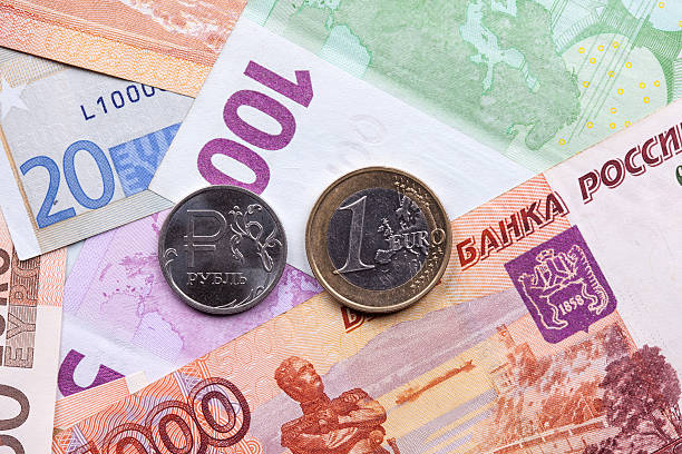 istock ruble euro coins and banknotes close up 503052268