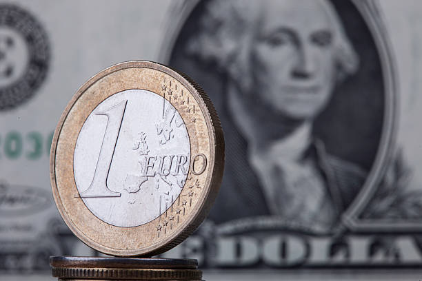 istock coin euro on the background bill dollar 503052690