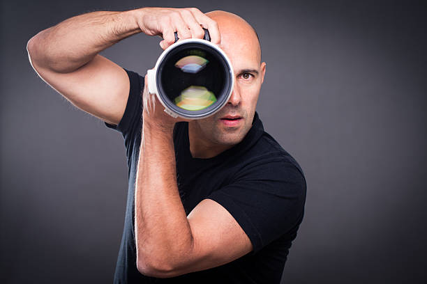 istock Young, pro male photographer in his studio 503052984