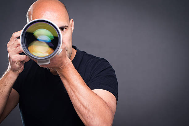 istock Young, pro male photographer in his studio 503053008