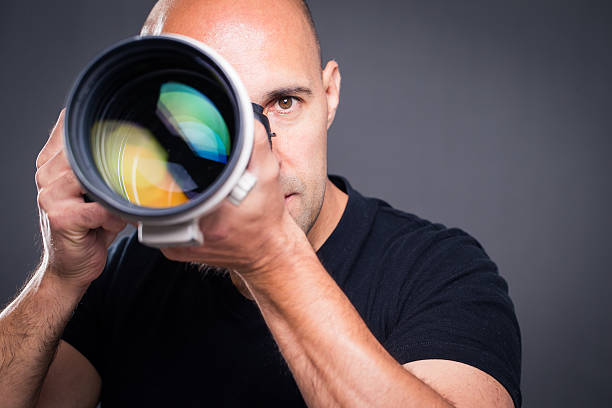 istock Young, pro male photographer in his studio 503053024