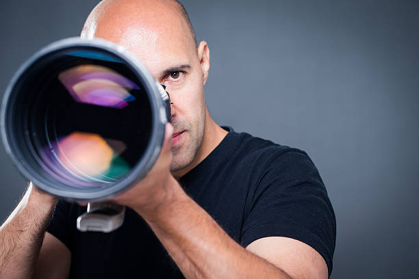 istock Young, pro male photographer in his studio 503053042