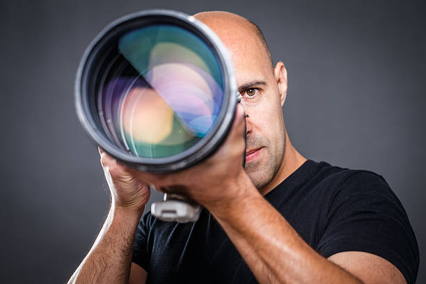 istock Young, pro male photographer in his studio 503053064