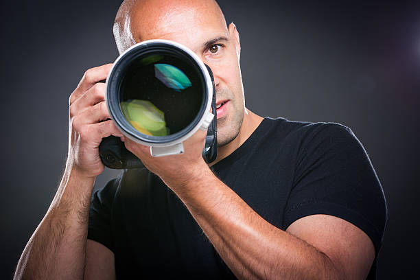 istock Young, pro male photographer in his studio 503053116
