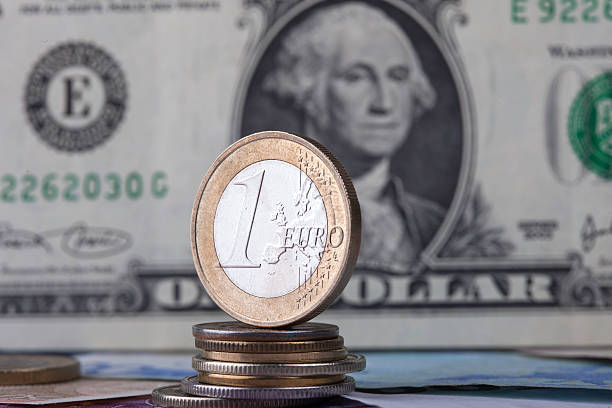 istock coin euro on the background bill dollar 503056418