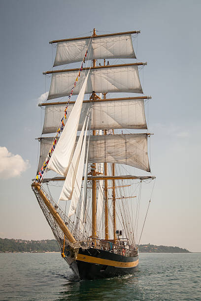 istock Old ship with white sales, sailing in the sea 503057042