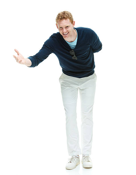 istock Smiling casual man bowing 503059070