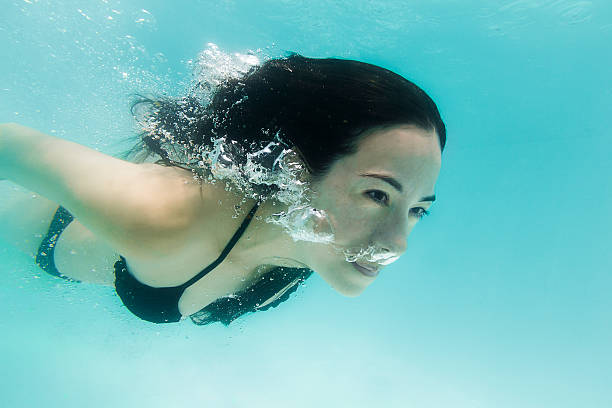 istock Pretty Woman Diving Underwater 503059616