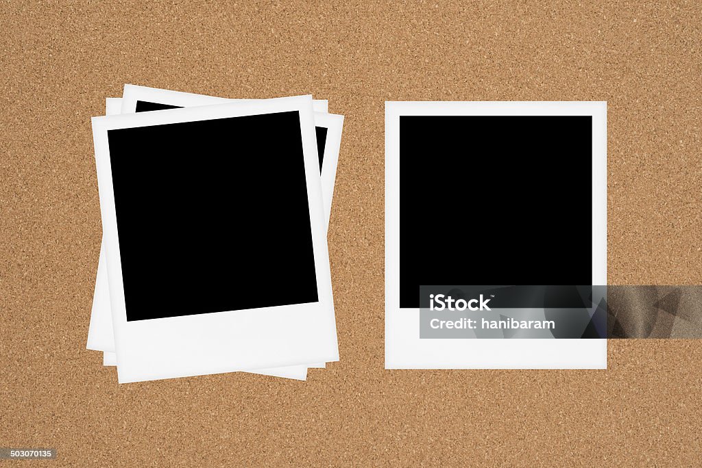 Blank photos on board Blank Instant Photos on Cork Board Black And White Stock Photo