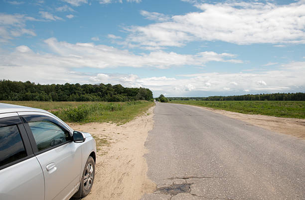 istock car on the side of a rural road 503071097