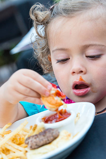 istock Little girl having lunch 503073479