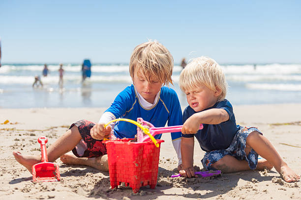 istock Brothers Playing at the Beach 503073777