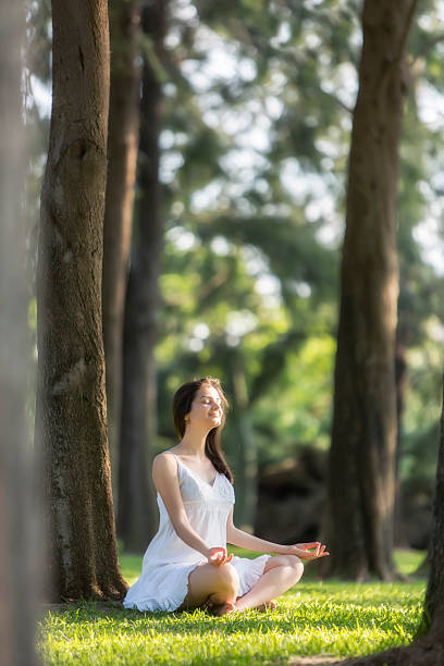istock Young woman meditating 503075023