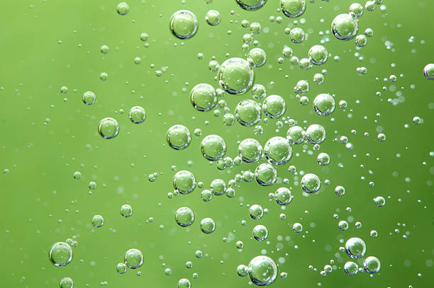 istock Air bubbles in a liquid. Abstract green background. Macro 503075201
