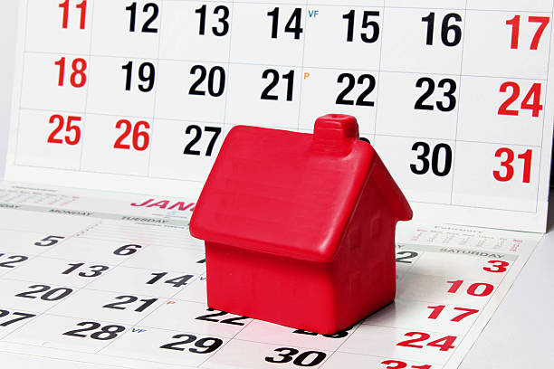 istock Miniature House on Calendar Pages 503077040